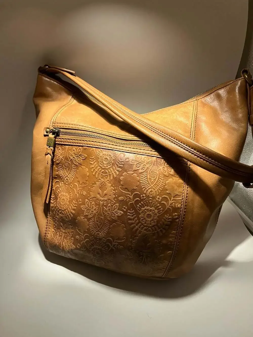 The Sak Sequoia Hobo Bag in Tobacco Floral Embossed Leather